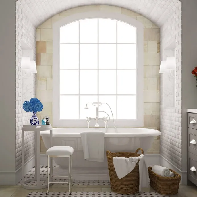 Badezimmer mit Badewanne ausgelegt mit weißen Wandfliesen und weiß/schwarzen Bodenfliesen